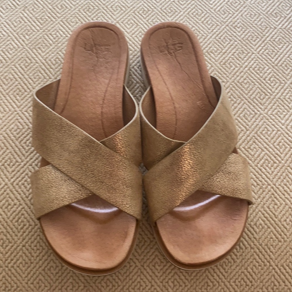 Ugg gold metallic slides.